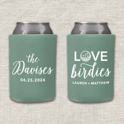 Two willow green can coolers with personalized text that says "Love Birdies" on a textured beige background