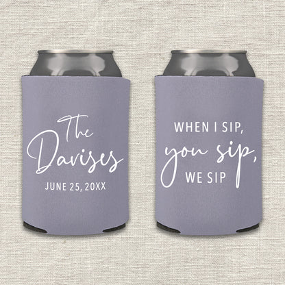 Two lilac gray can coolers with personalized text that says "When I sip, you sip, we sip" on a textured surface