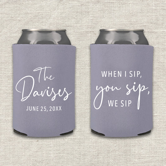 Two lilac gray can coolers with personalized text that says "When I sip, you sip, we sip" on a textured surface